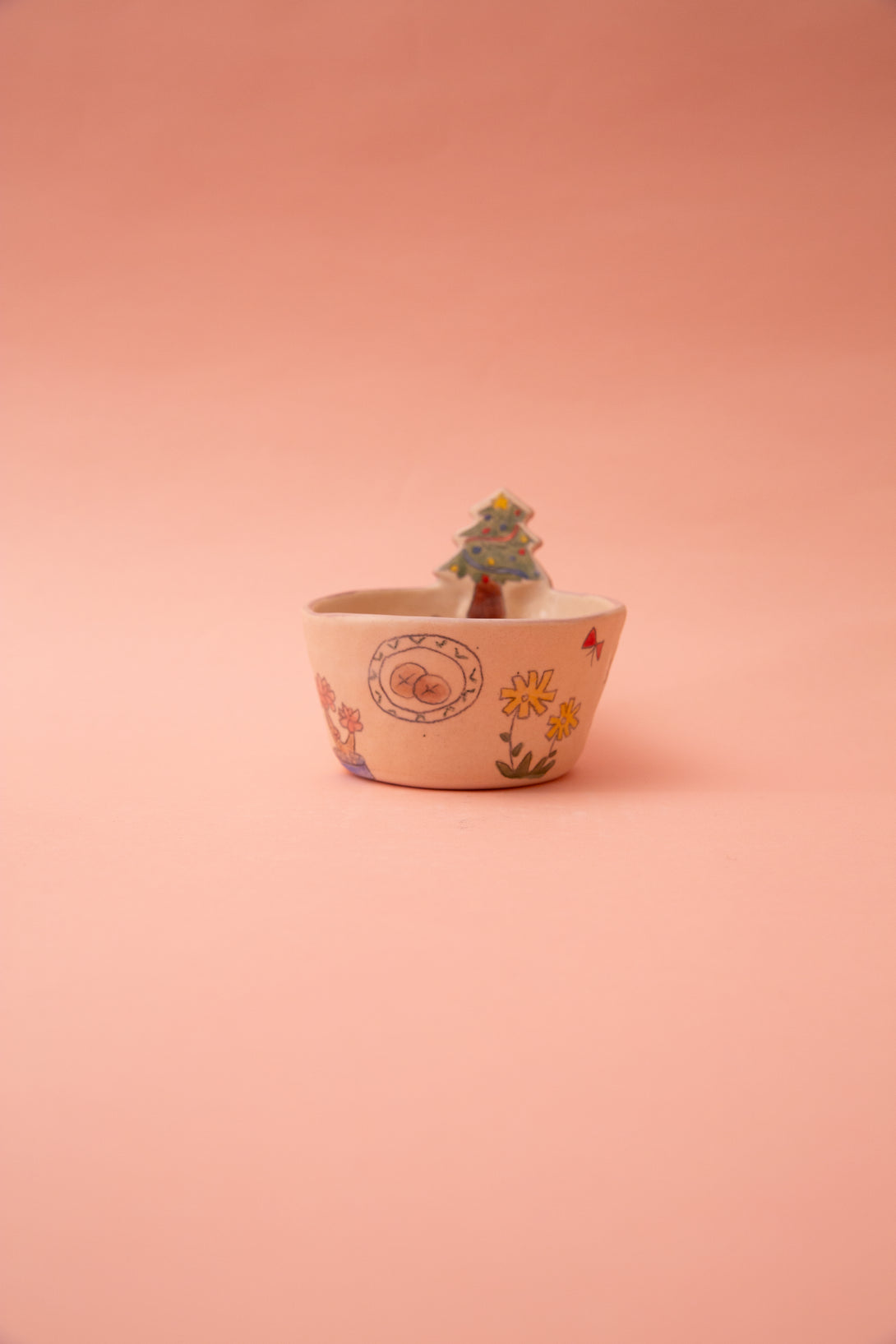 Small bowl with a tree on a pink background