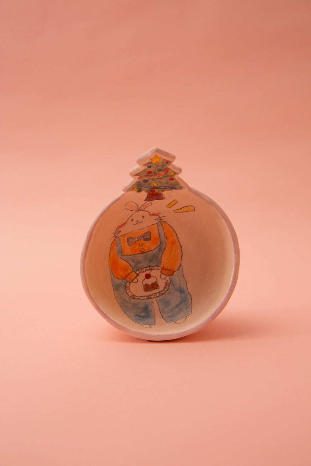 ceramic bowl with a cartoon character on a pink background
