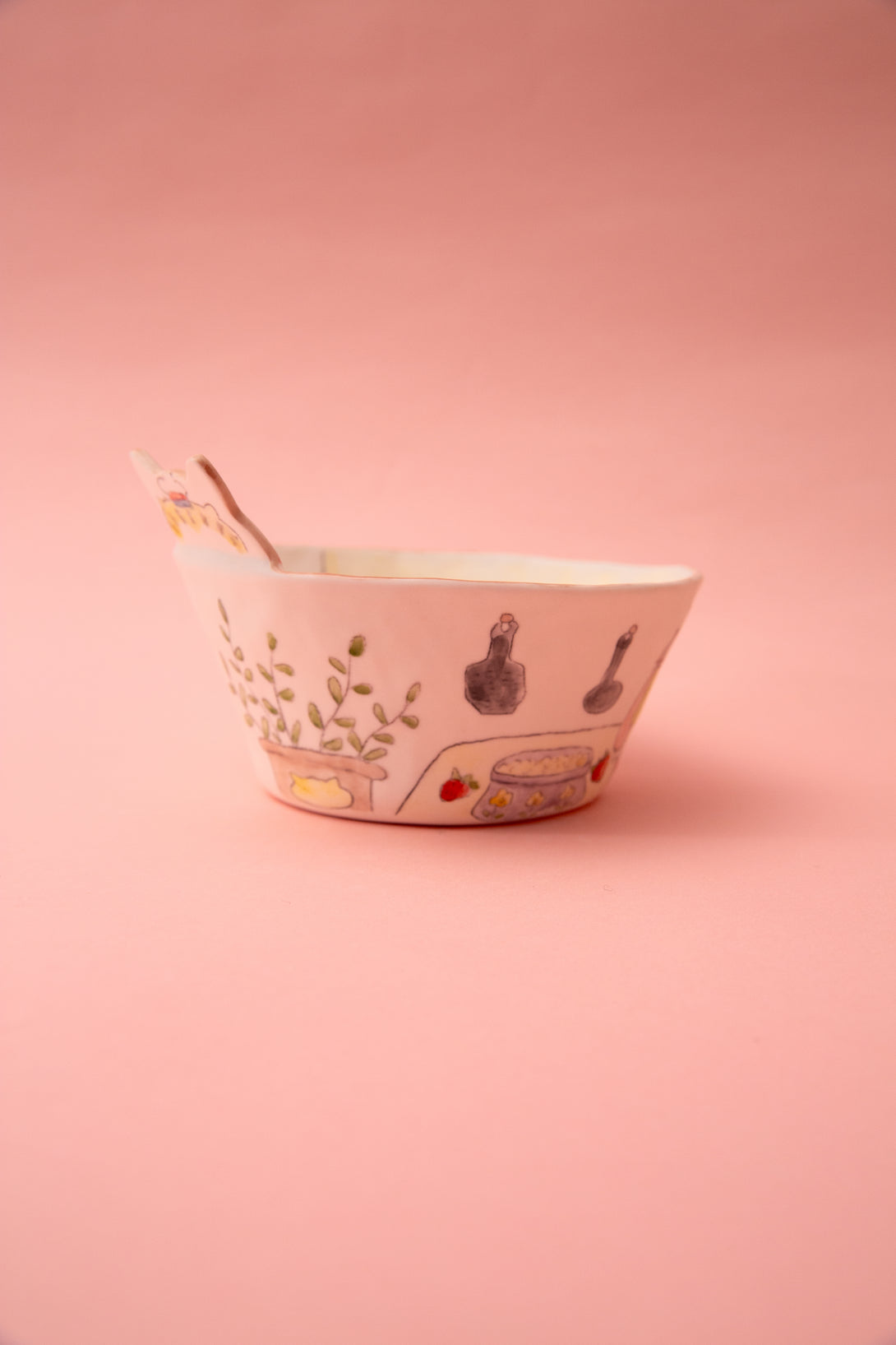 Ceramic bowl with illustrations on a pink background
