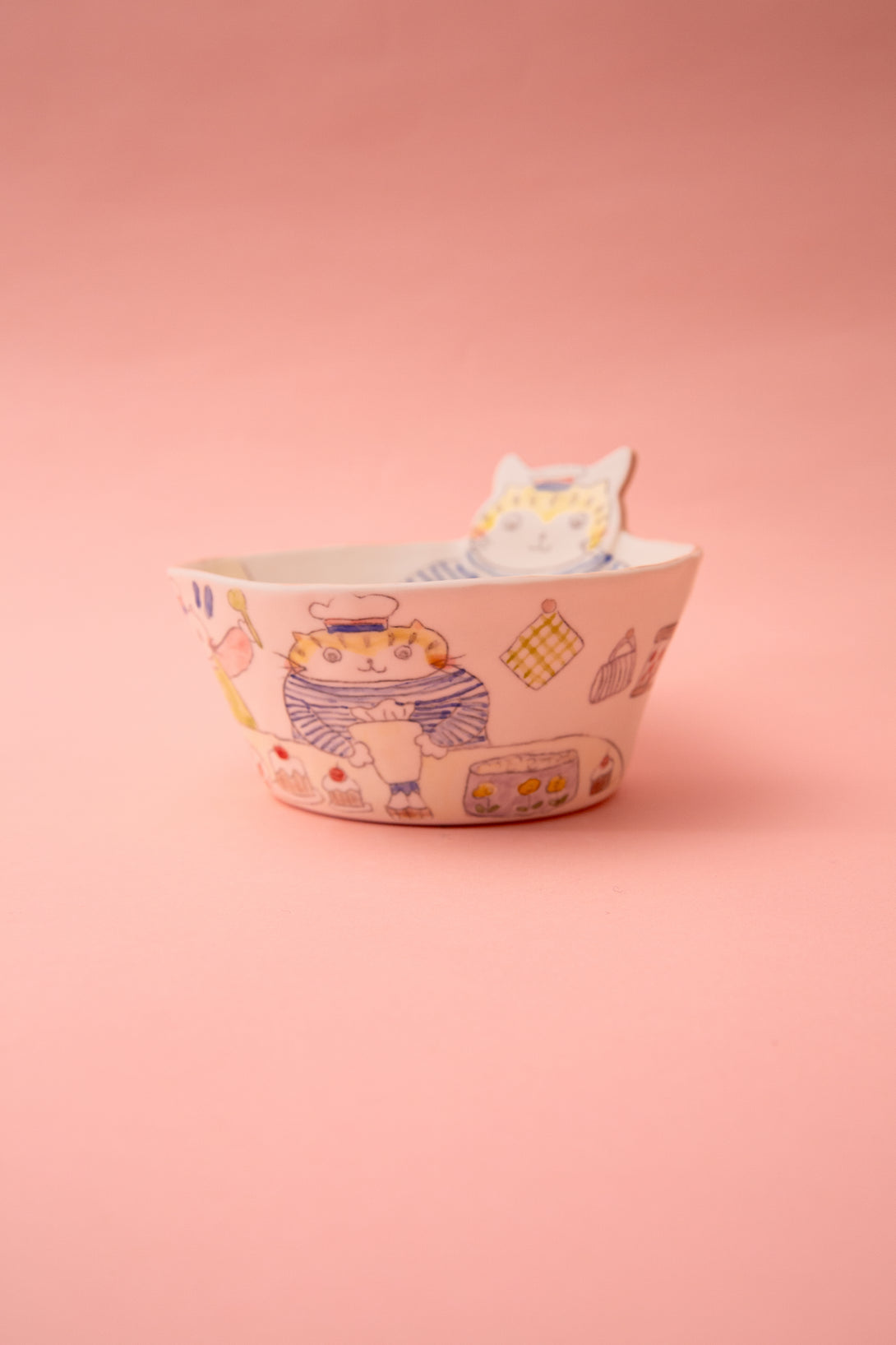 Ceramic bowl with a pattern on a pink background