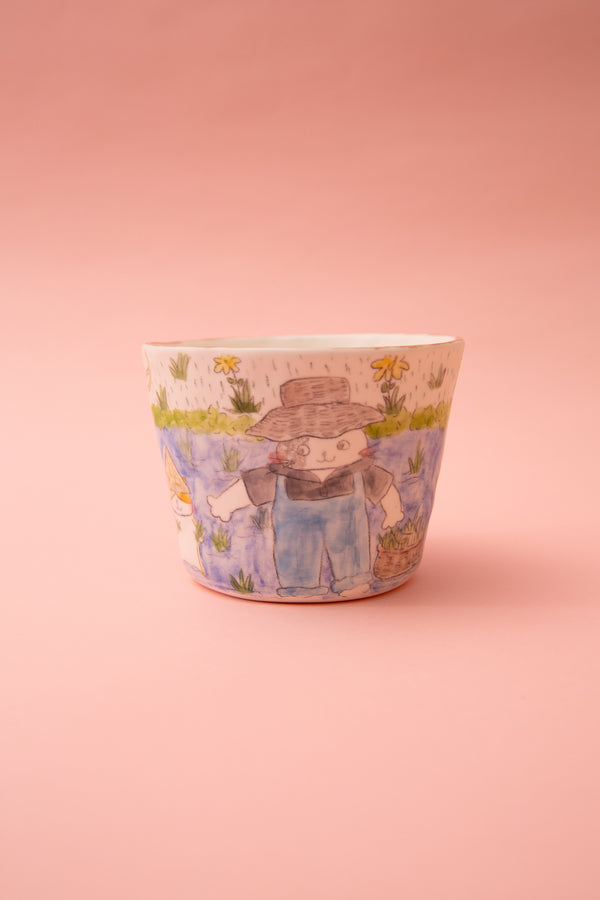 Ceramic mug with a cartoon character on a pink background