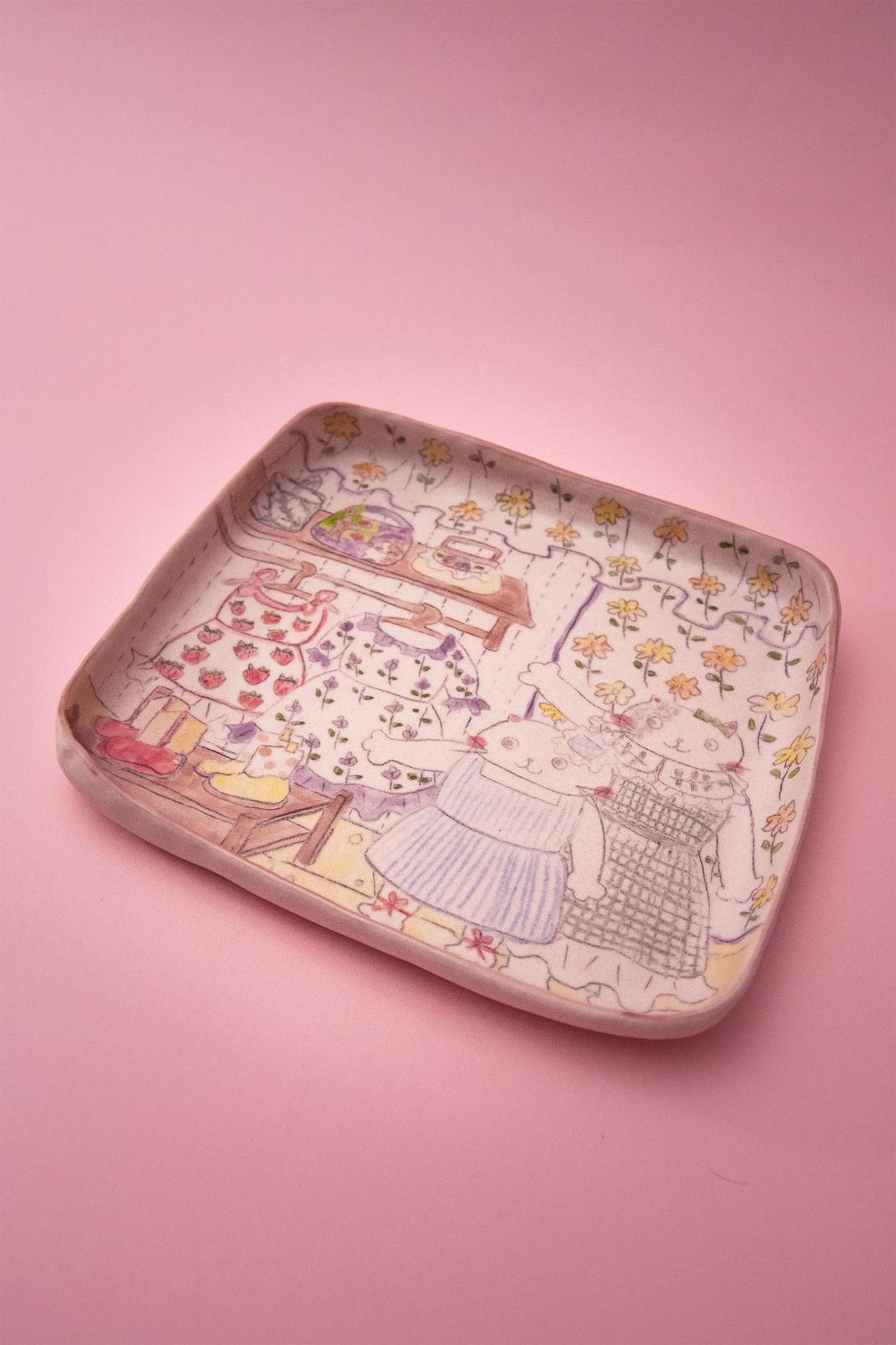 Plate with artistic design on a pink background