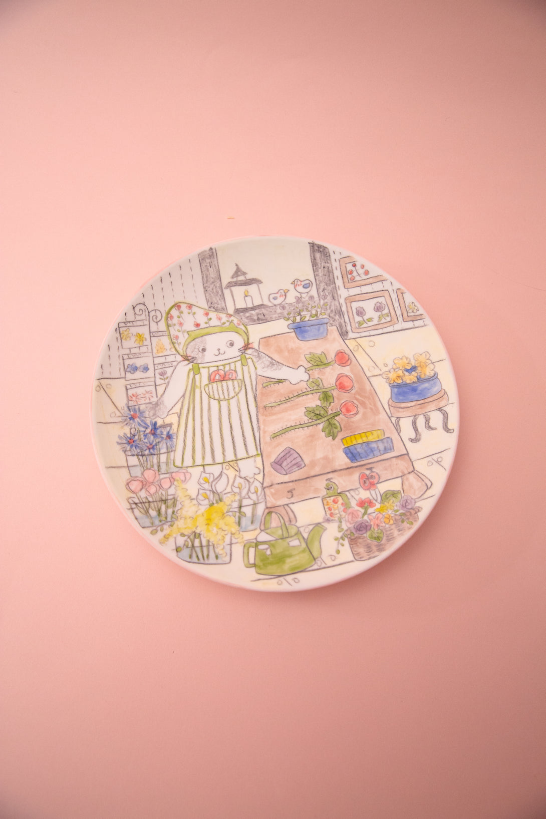 Circular plate with illustration of a cartoon character in a flower shop on a pink background