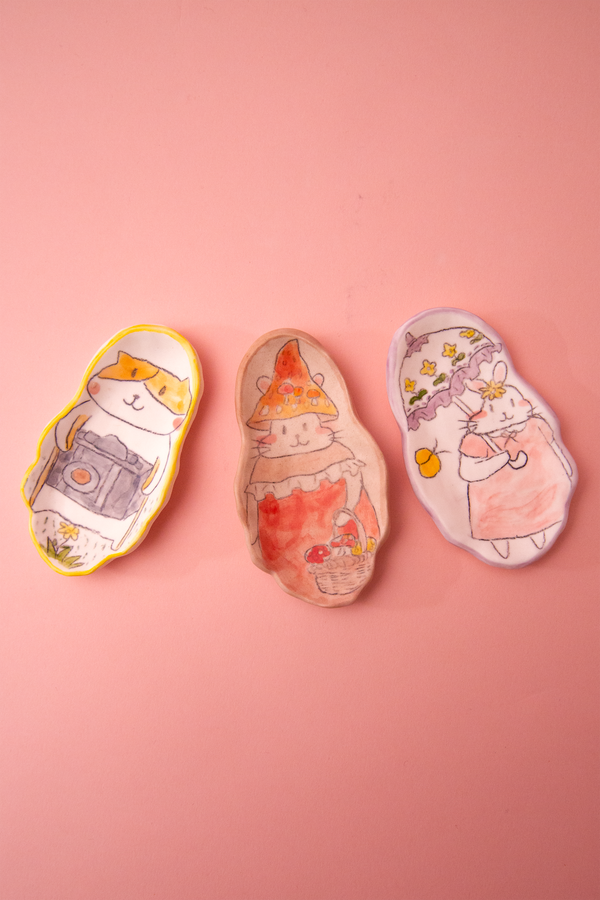 Spoon rests with cartoonanimal designs on a pink background