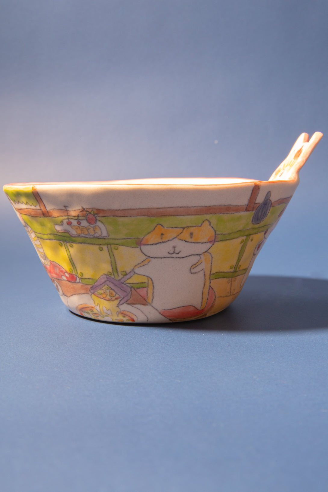 Ceramic bowl with a dog character design on a blue background