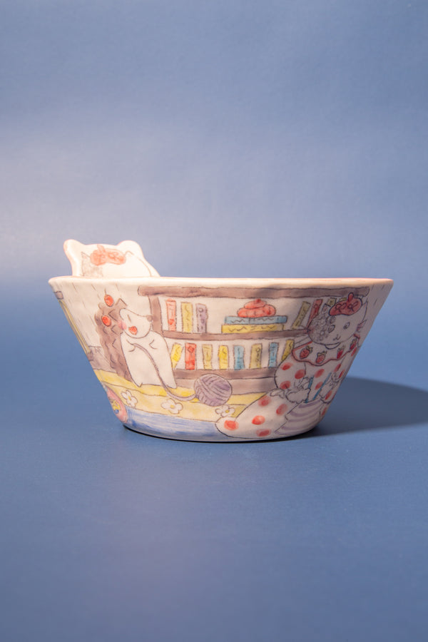 Ceramic bowl with colorful design on a blue background
