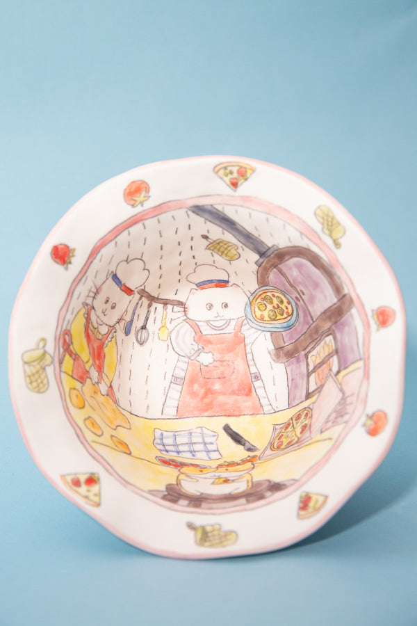 Decorative bowl with cartoon characters on a blue background
