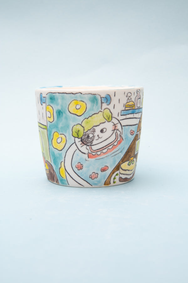 Ceramic cup with cartoon design on a light blue background
