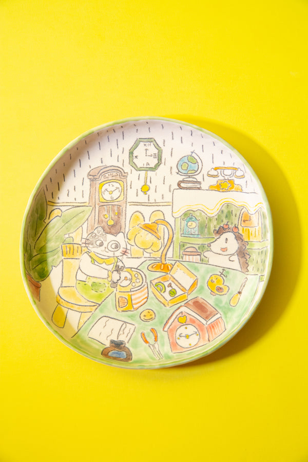 plate with cartoon-style illustration of a room on a yellow background