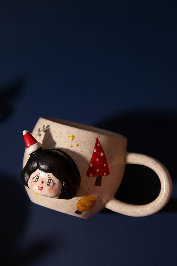 Christmas mug with a decorative design of a hat and tree on a dark background