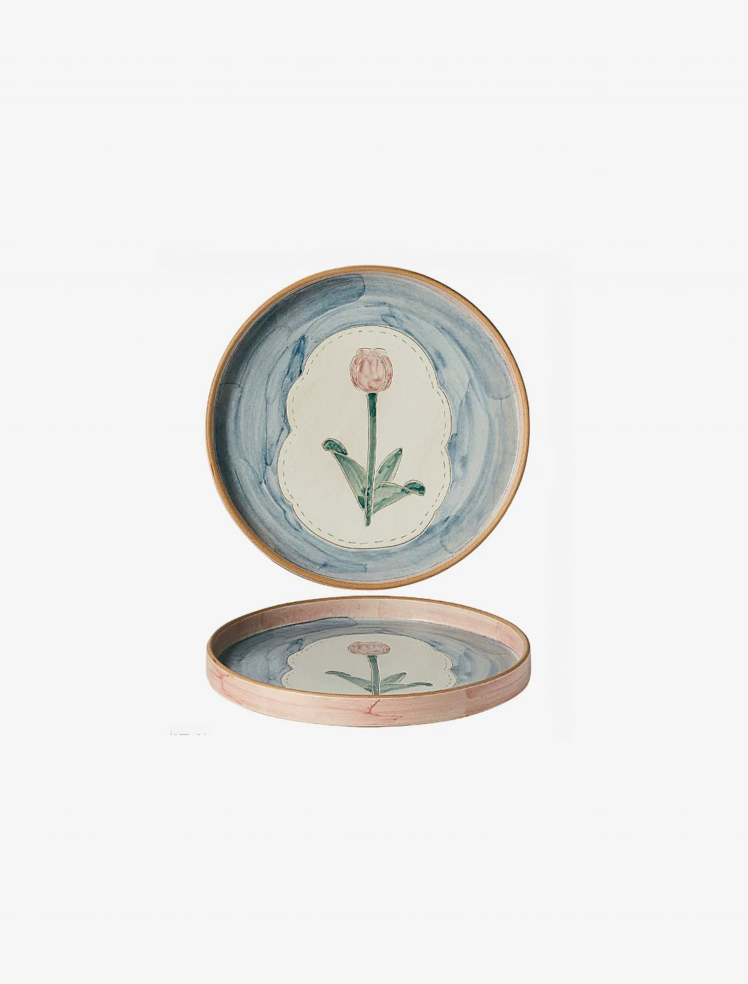 ceramic plate with a floral pattern, primarily in blue and pink colors.