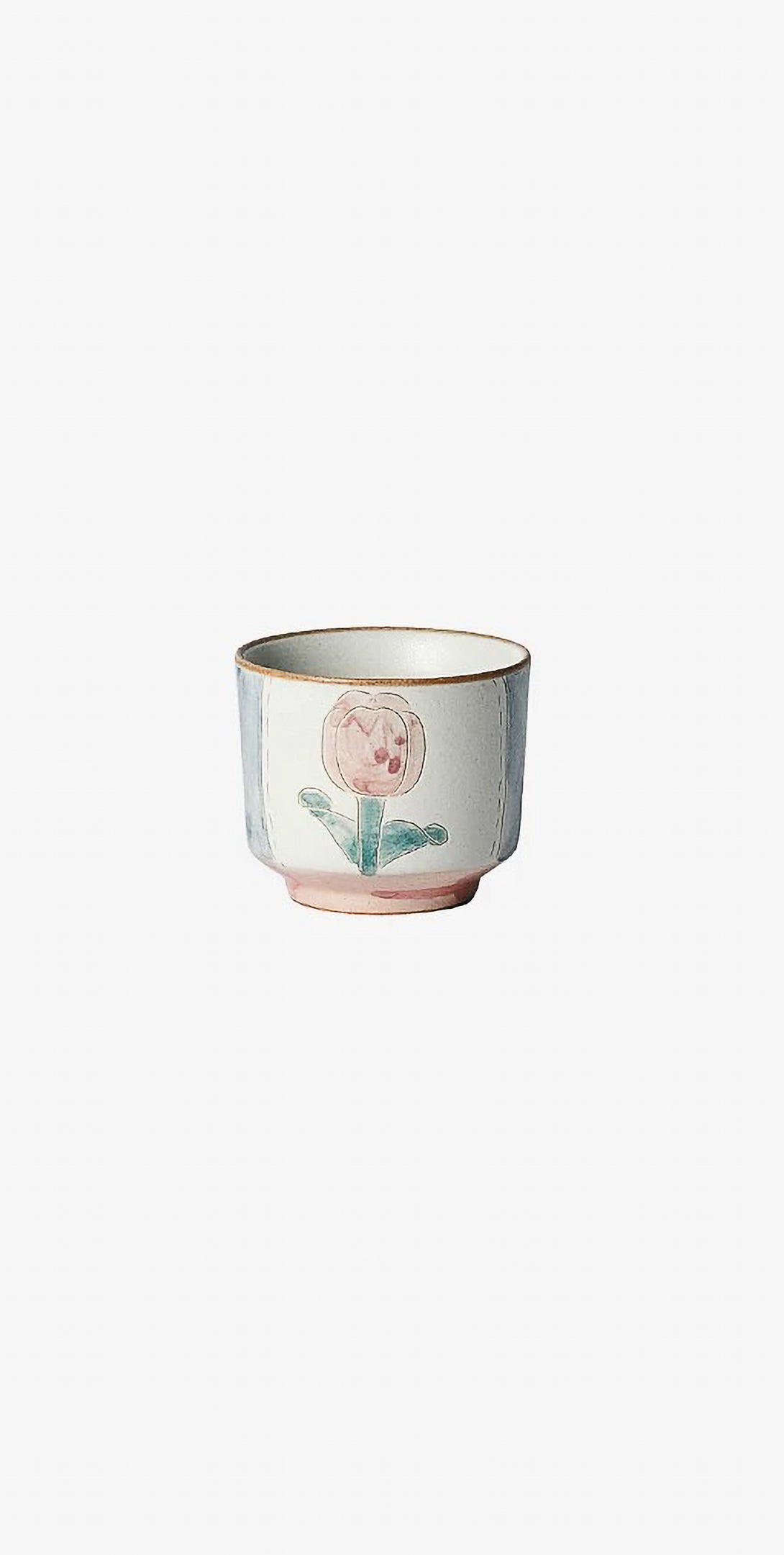 ceramic cup in floral patterns, primarily in blue and pink colors.