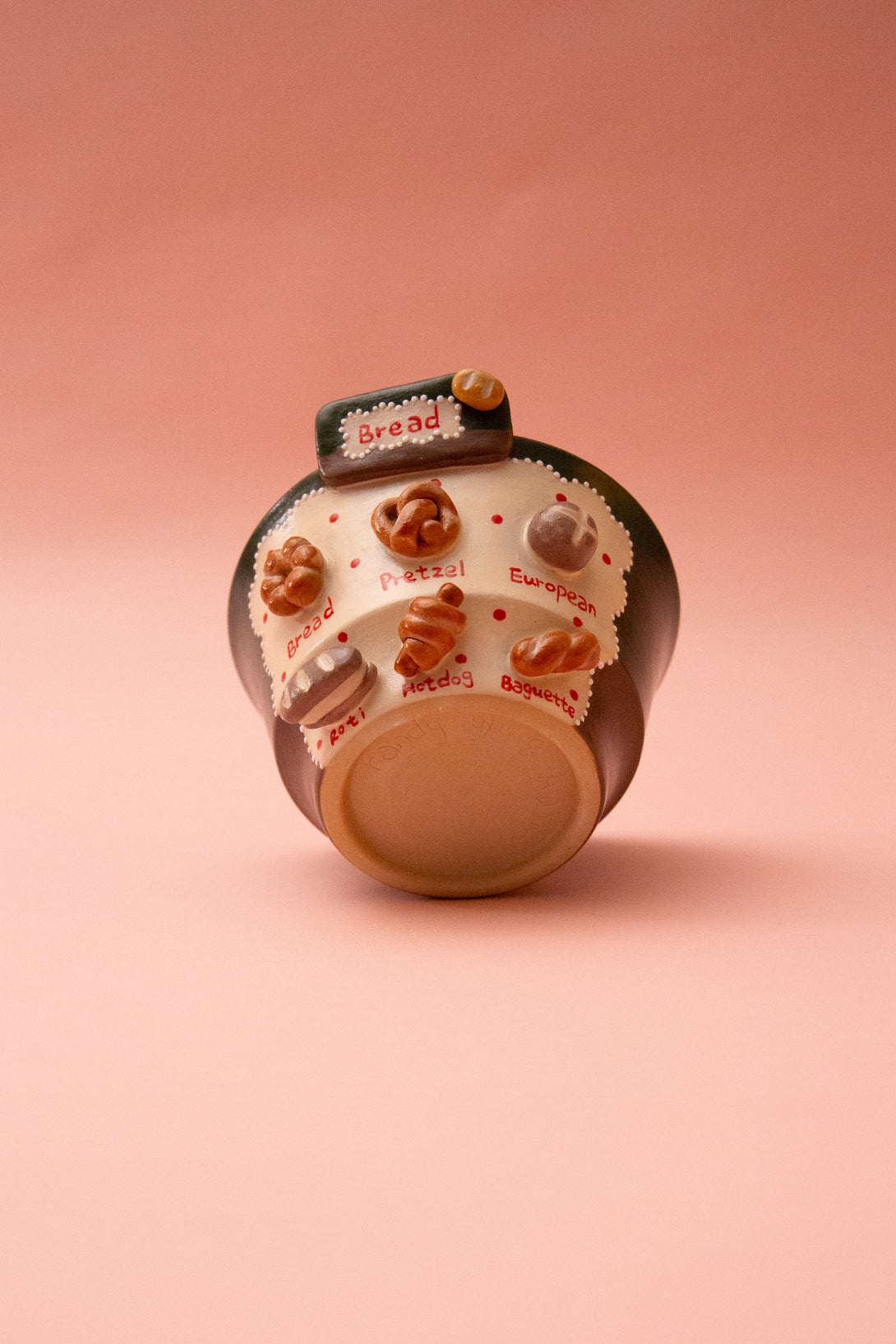 bread-themed bowl on a pink background