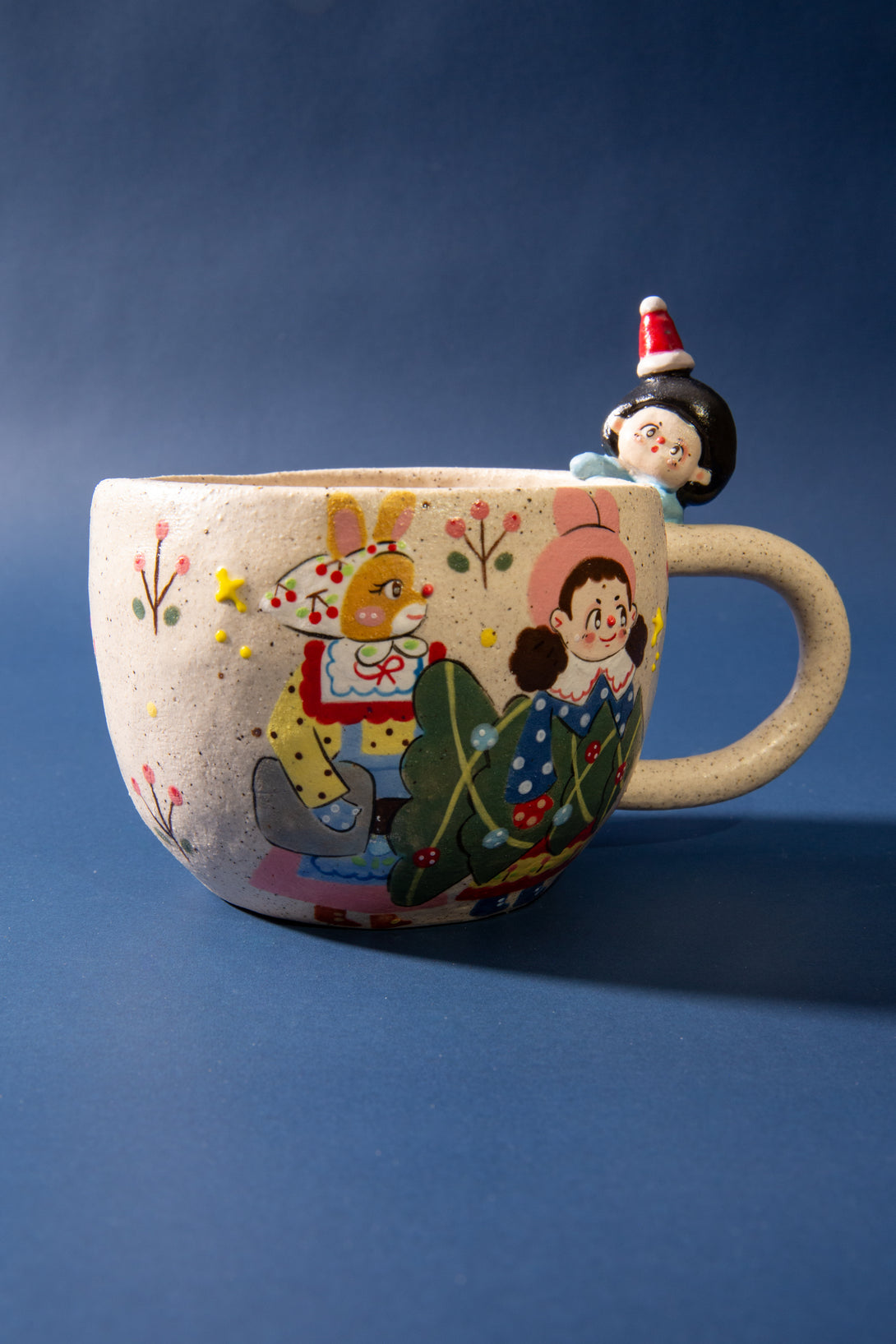 christmas mug with cartoon characters on a blue background
