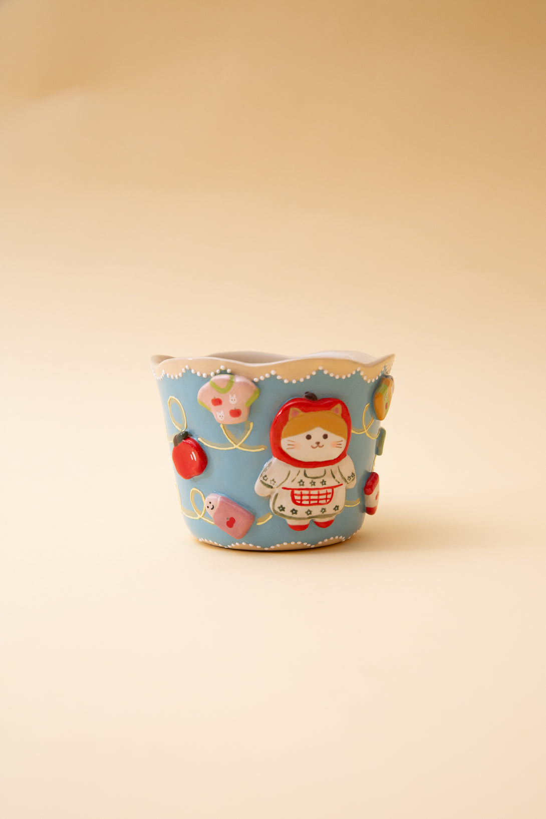 cup with cartoon character design on a beige background