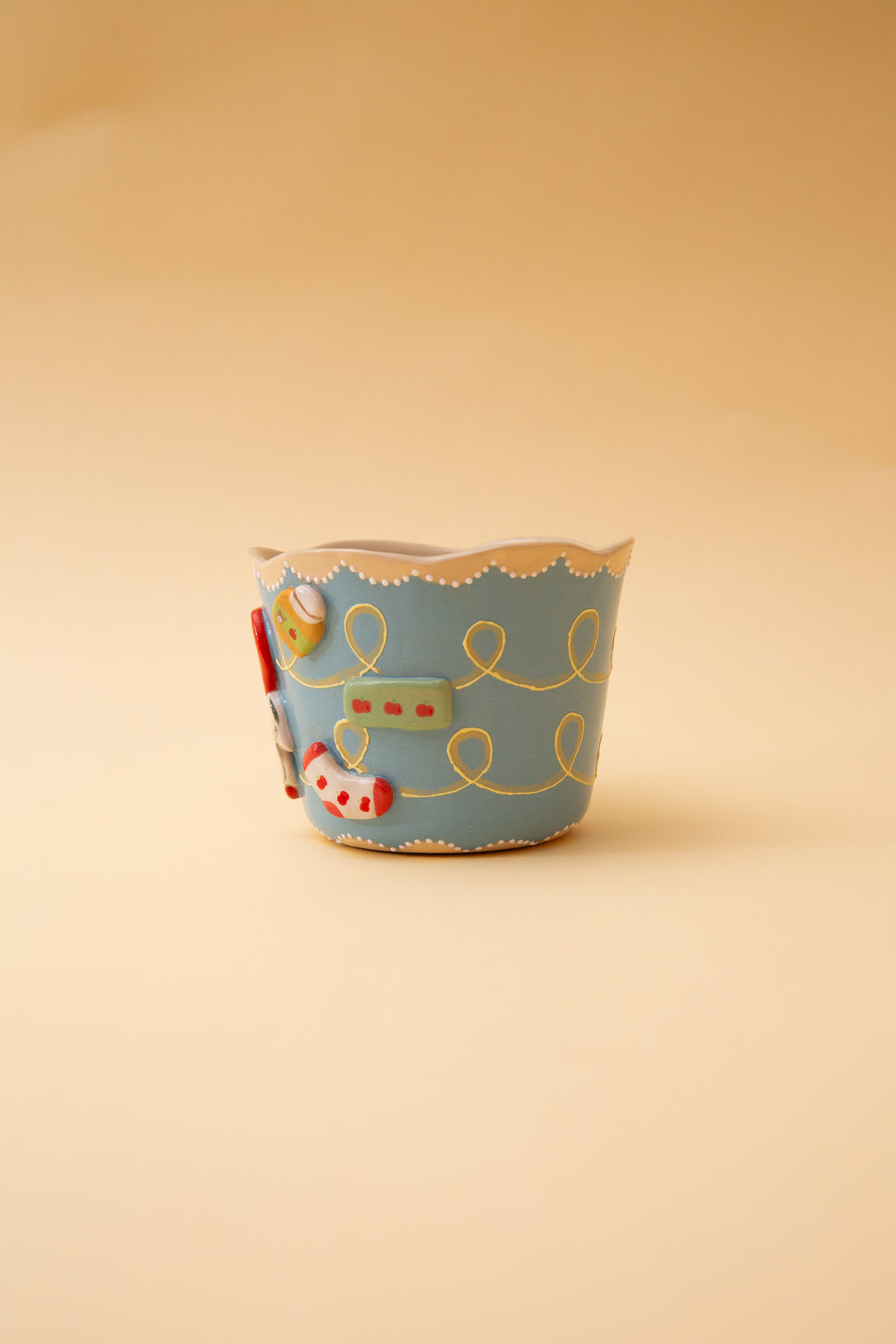 cup with cartoon character on a beige background