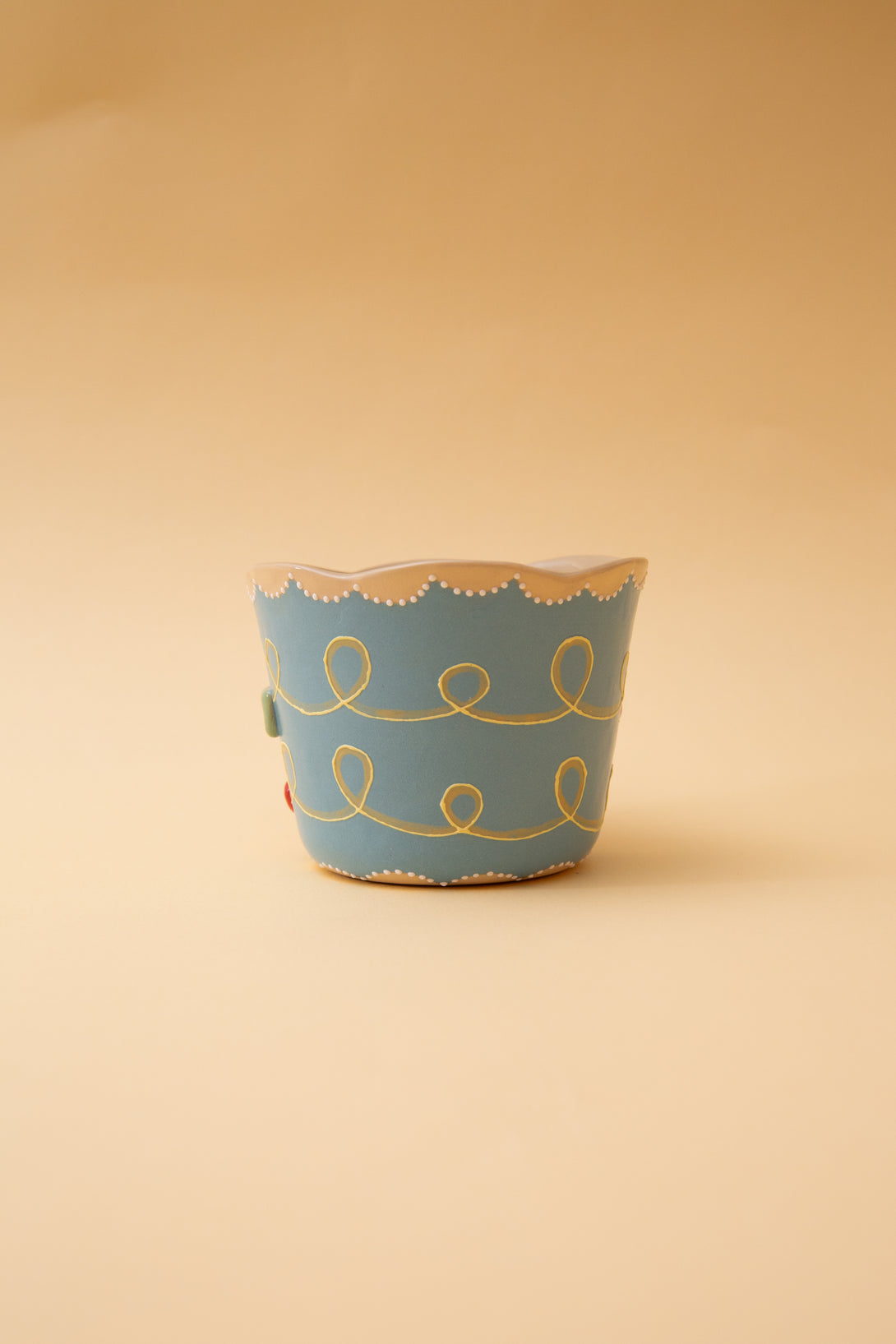 cup with gold patterns on a beige background