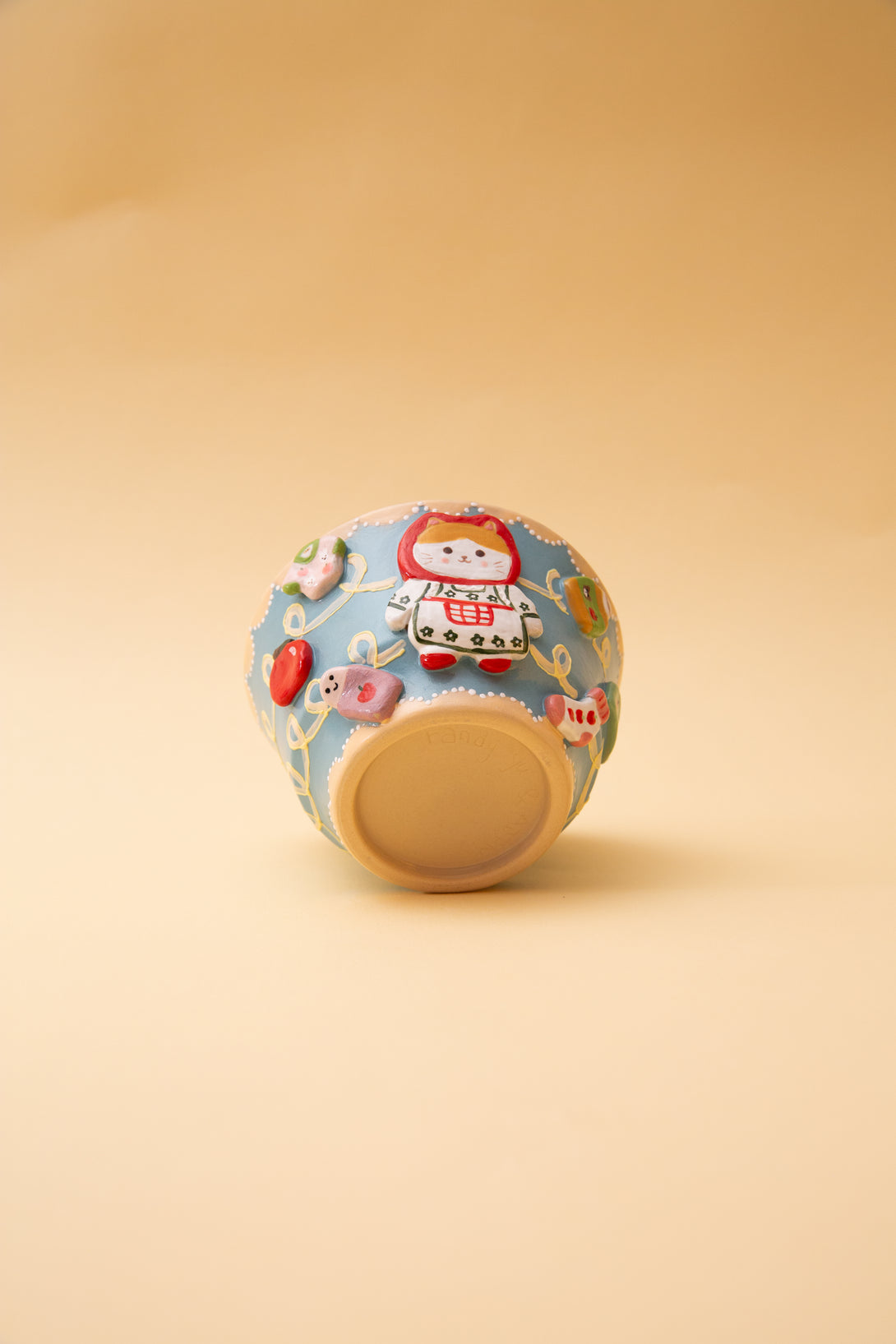 ceramic bowl with cartoon character design on a beige background