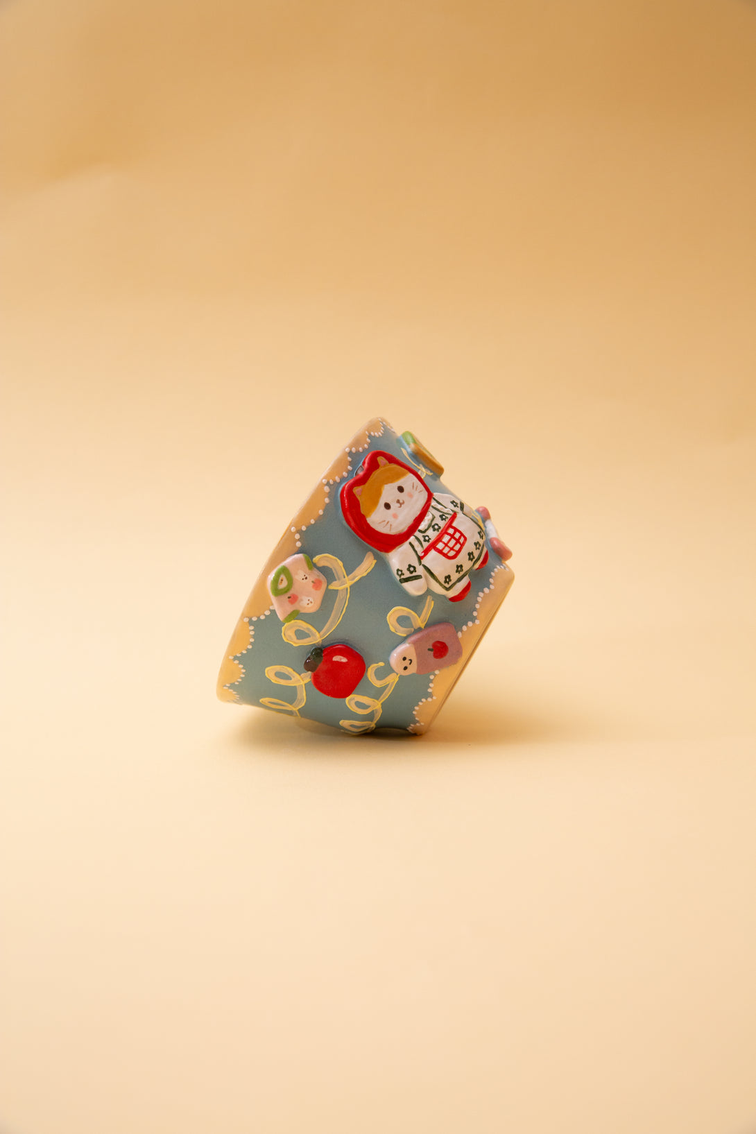 ceramic bowl with cartoon character on a beige background