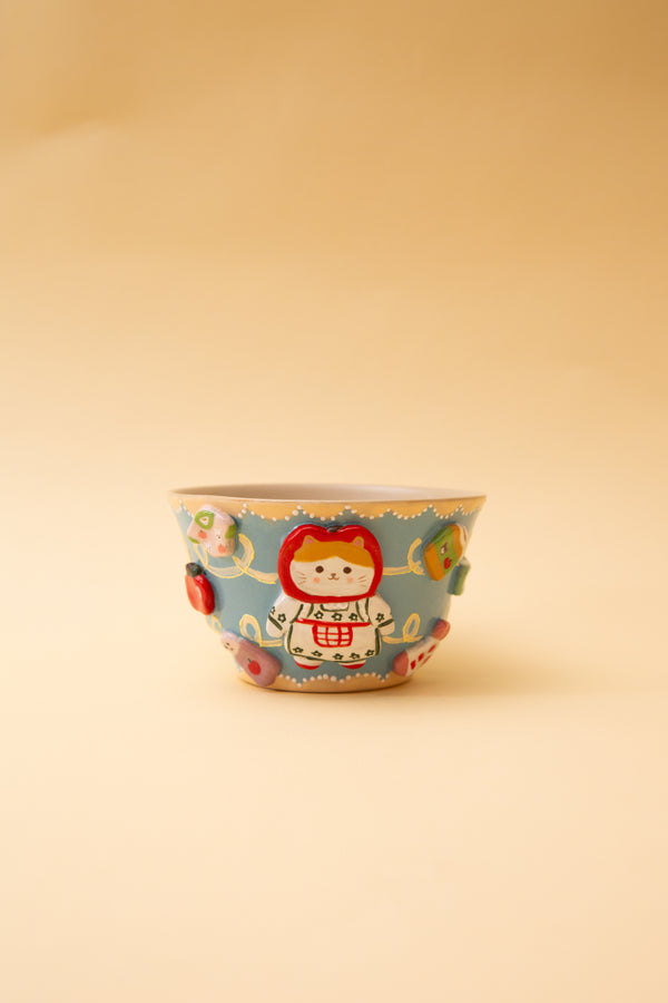 ceramic bowl with colorful design on a beige background