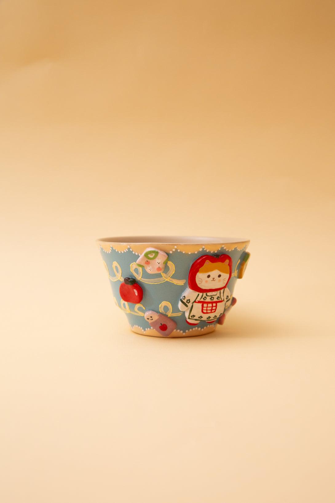 ceramic bowl with cartoon character on a beige background