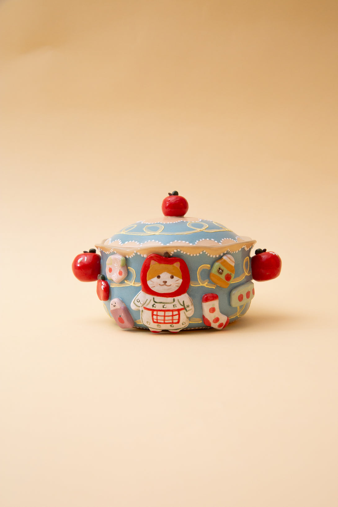 ceramic bowl with a lid with a cartoon character on a beige background